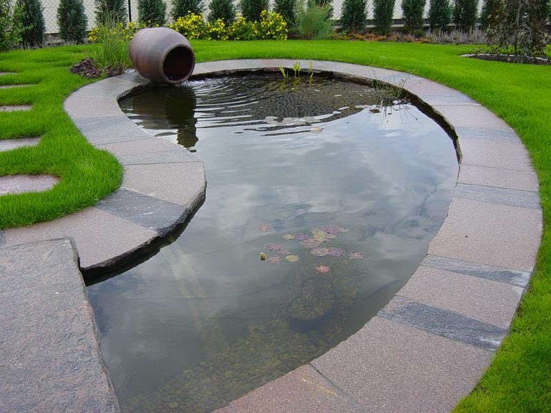 Project: Street furniture installed around a pond surrounded by stone slabs.