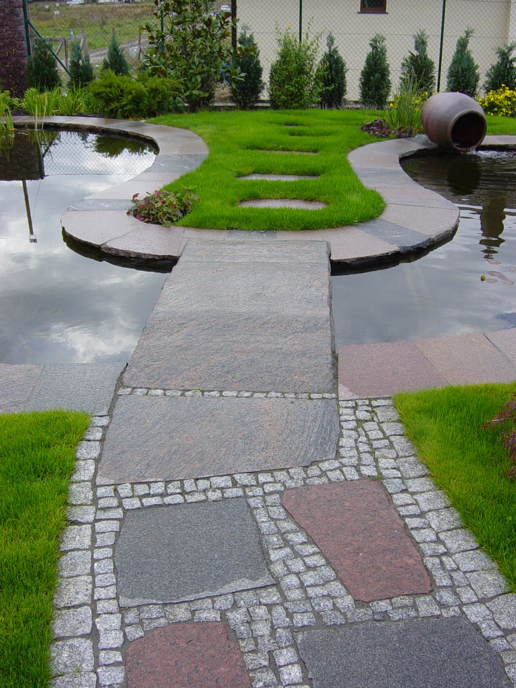Project: A pond landscaped using granite slabs