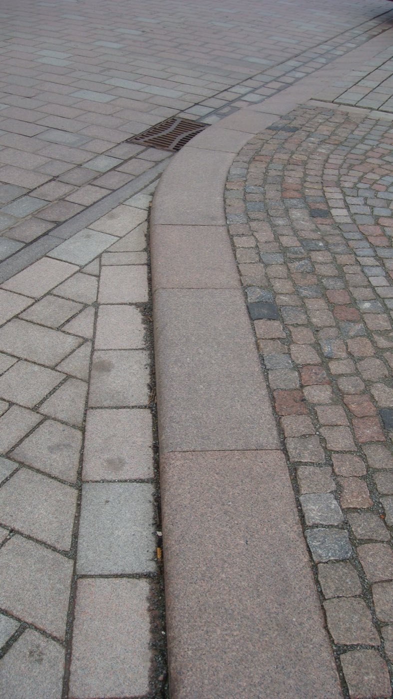 Project: Red Bohus—flame-treated, rounded curbs combined with granite pavers