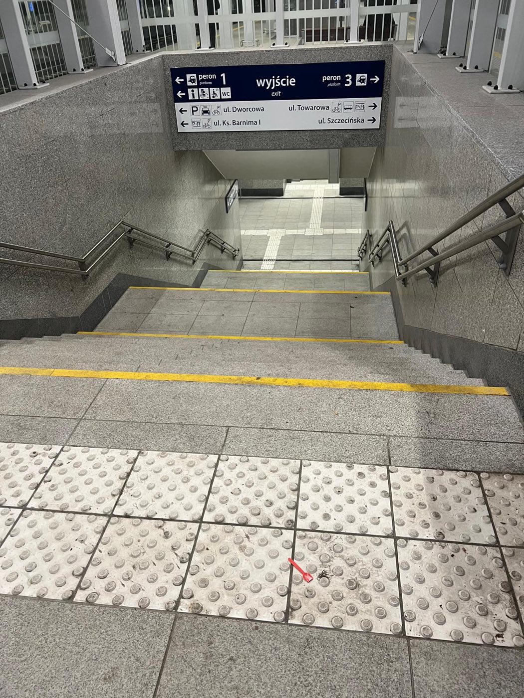 Project: LIGHT GRAY SLABS — flooring, stairs, and walls at the train station