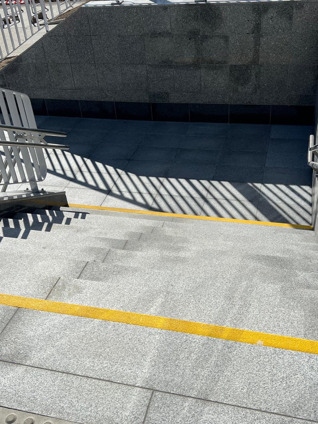 Project: LIGHT GRAY SLABS — flooring, stairs, and walls at the train station
