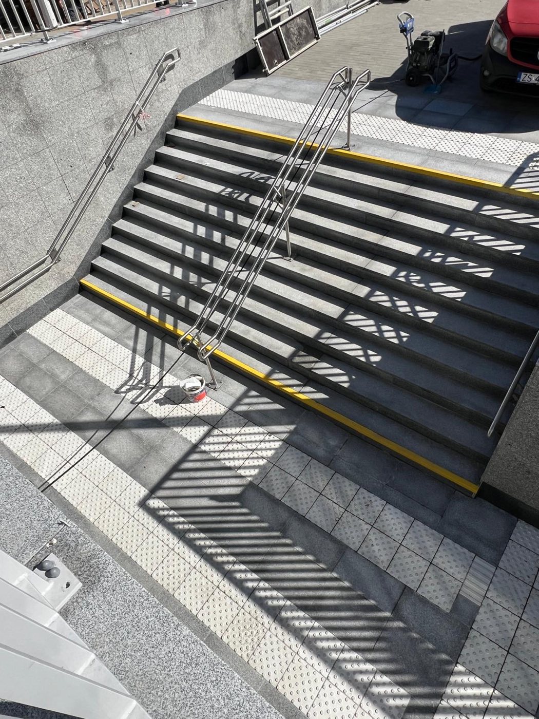Project: LIGHT GRAY SLABS — flooring, stairs, and walls at the train station