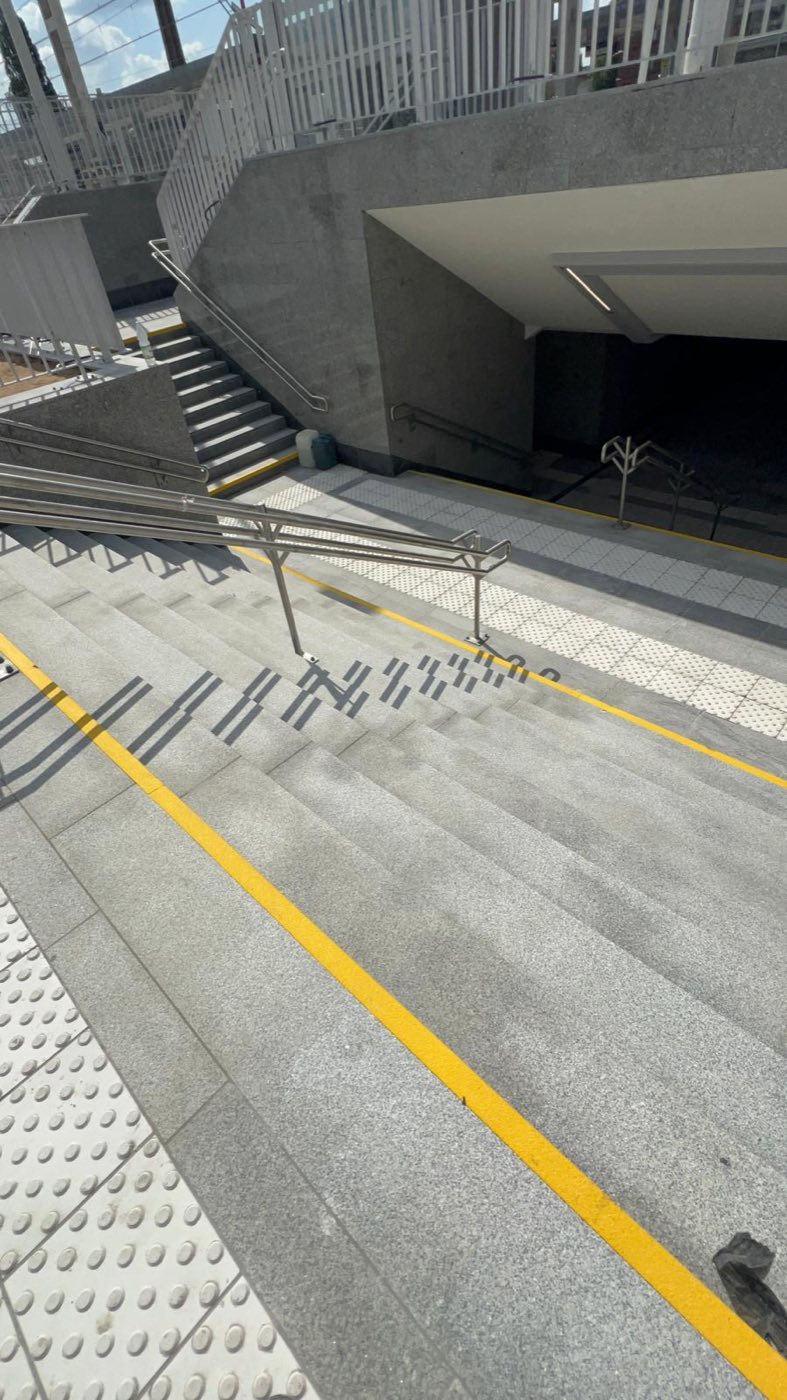 Project: LIGHT GRAY SLABS — flooring, stairs, and walls at the train station