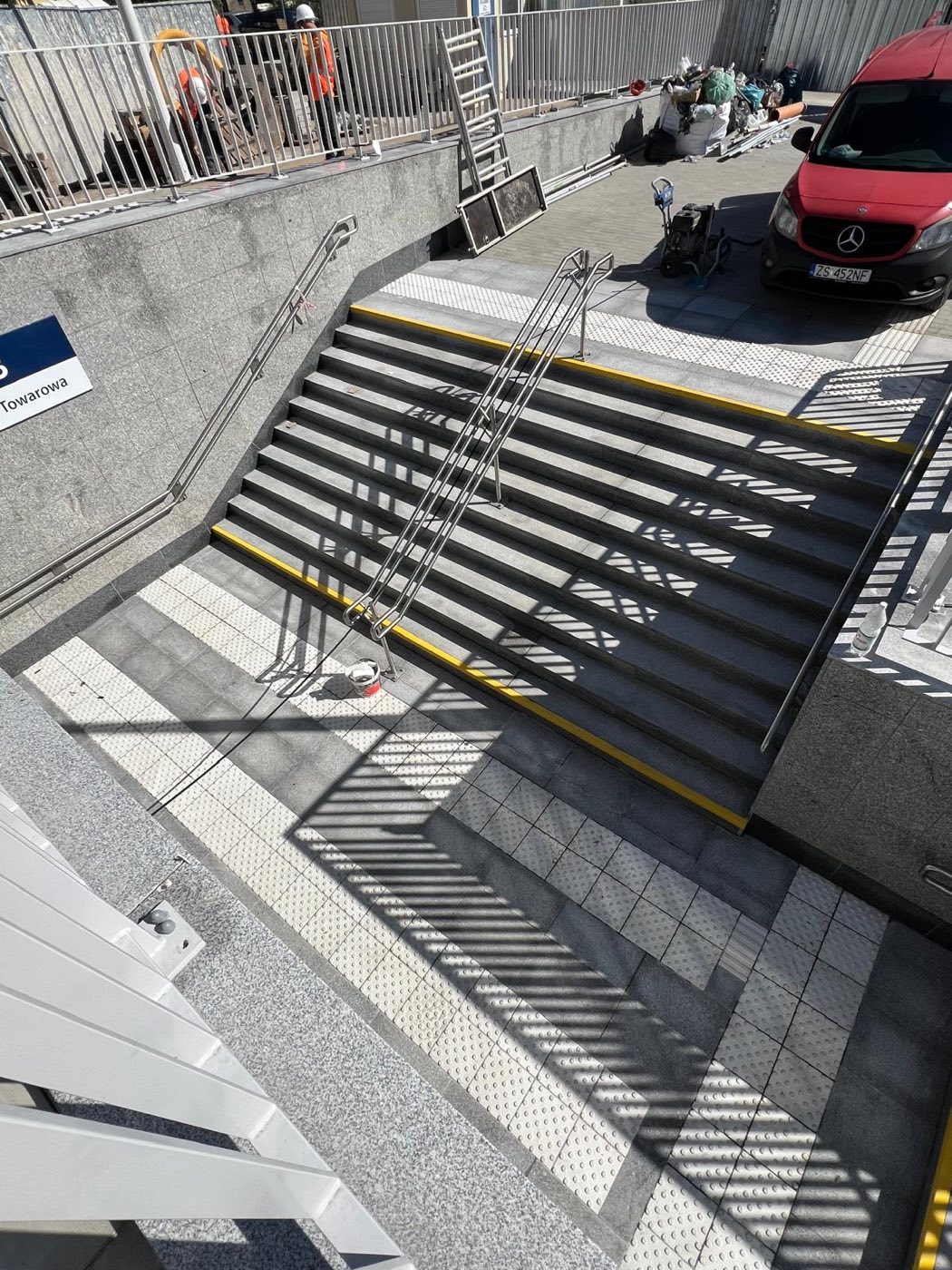 Project: LIGHT GRAY SLABS — flooring, stairs, and walls at the train station