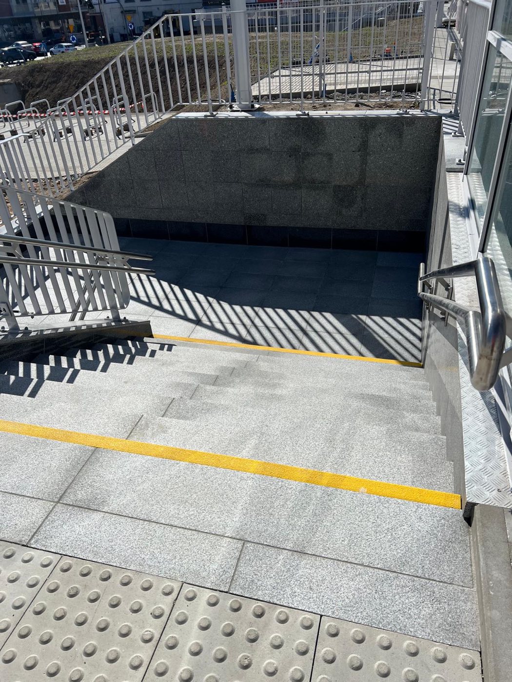 Project: LIGHT GRAY SLABS — flooring, stairs, and walls at the train station